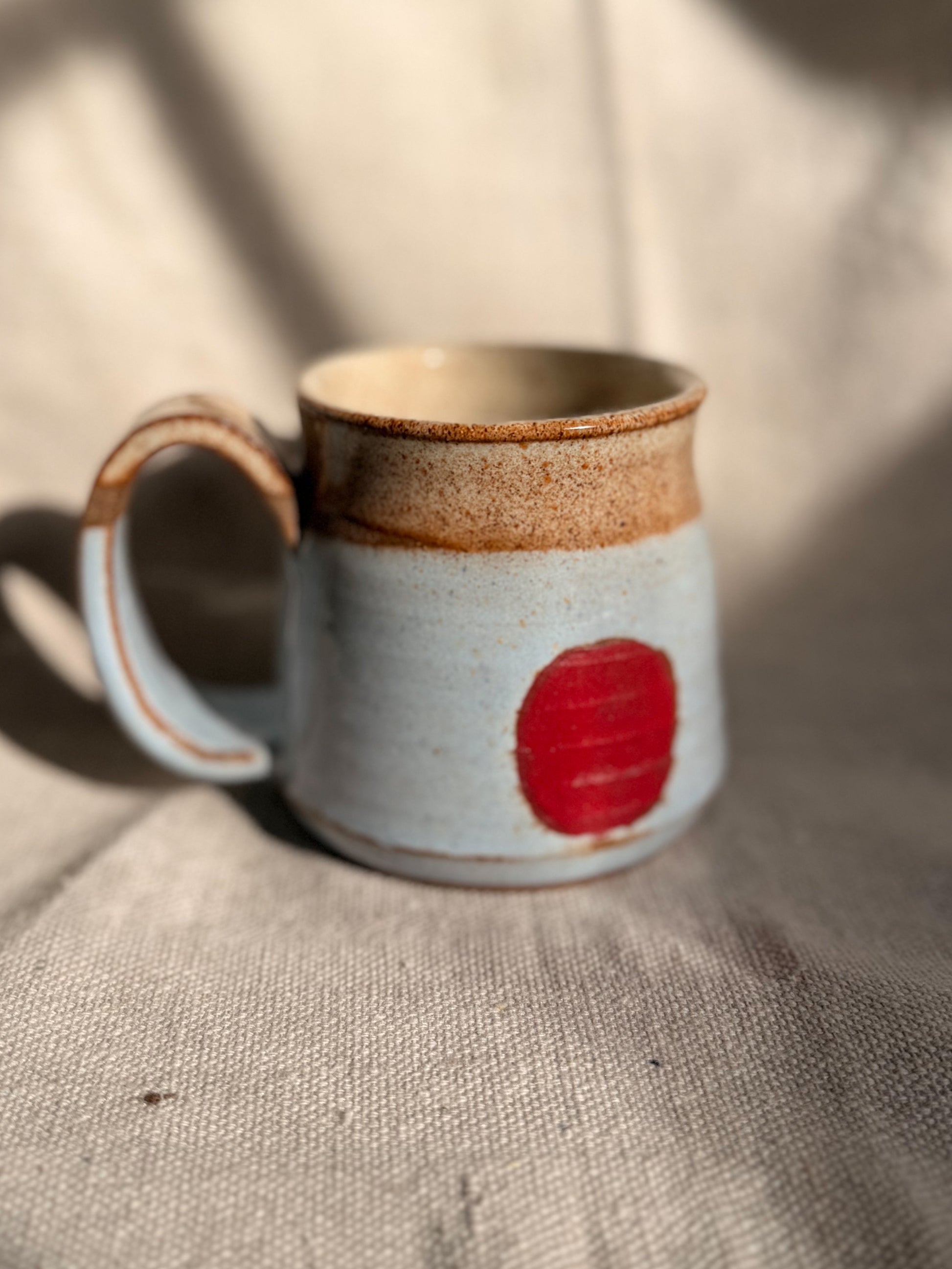 baby blue mug with red dot