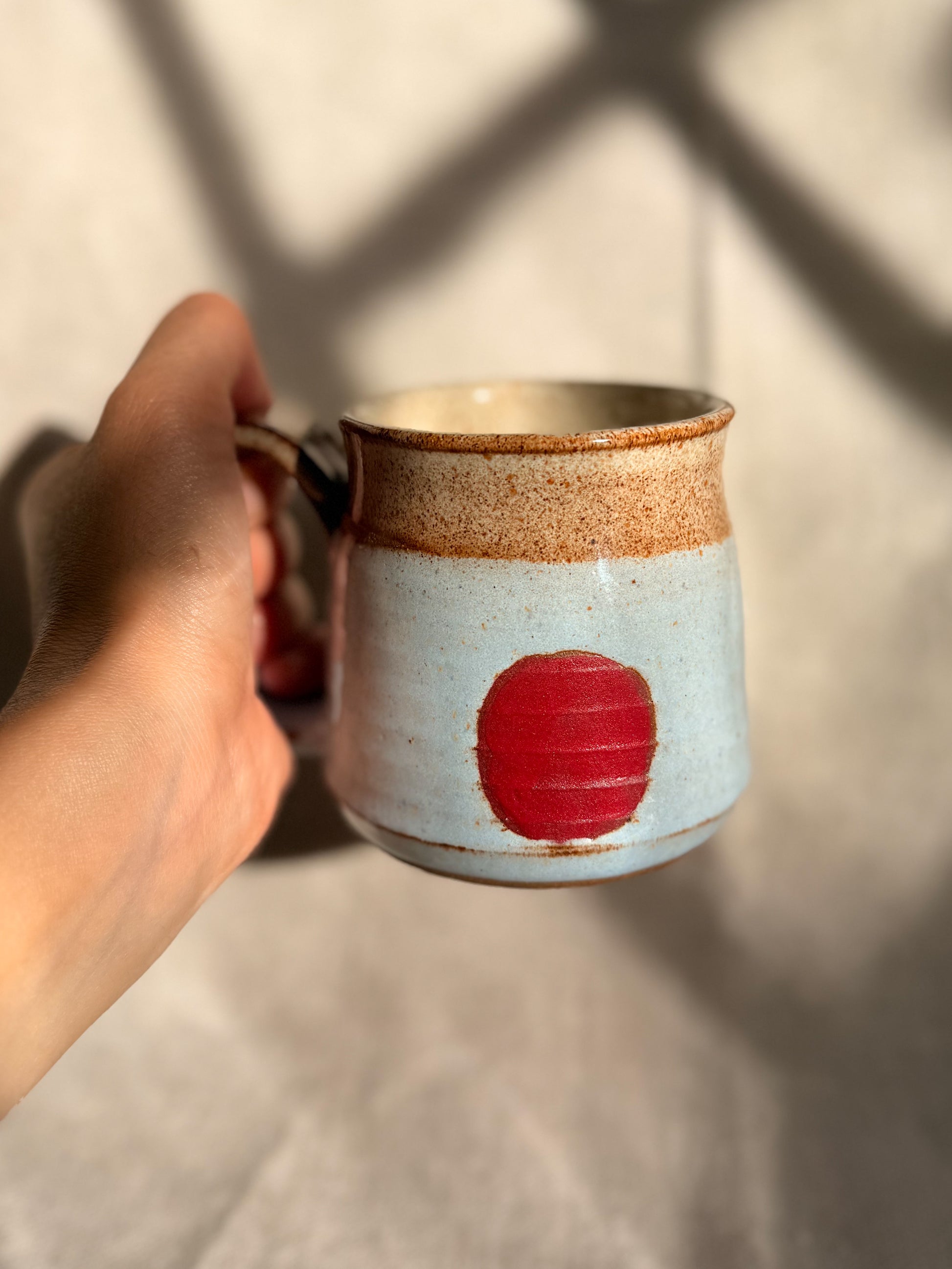 baby blue mug with red dot