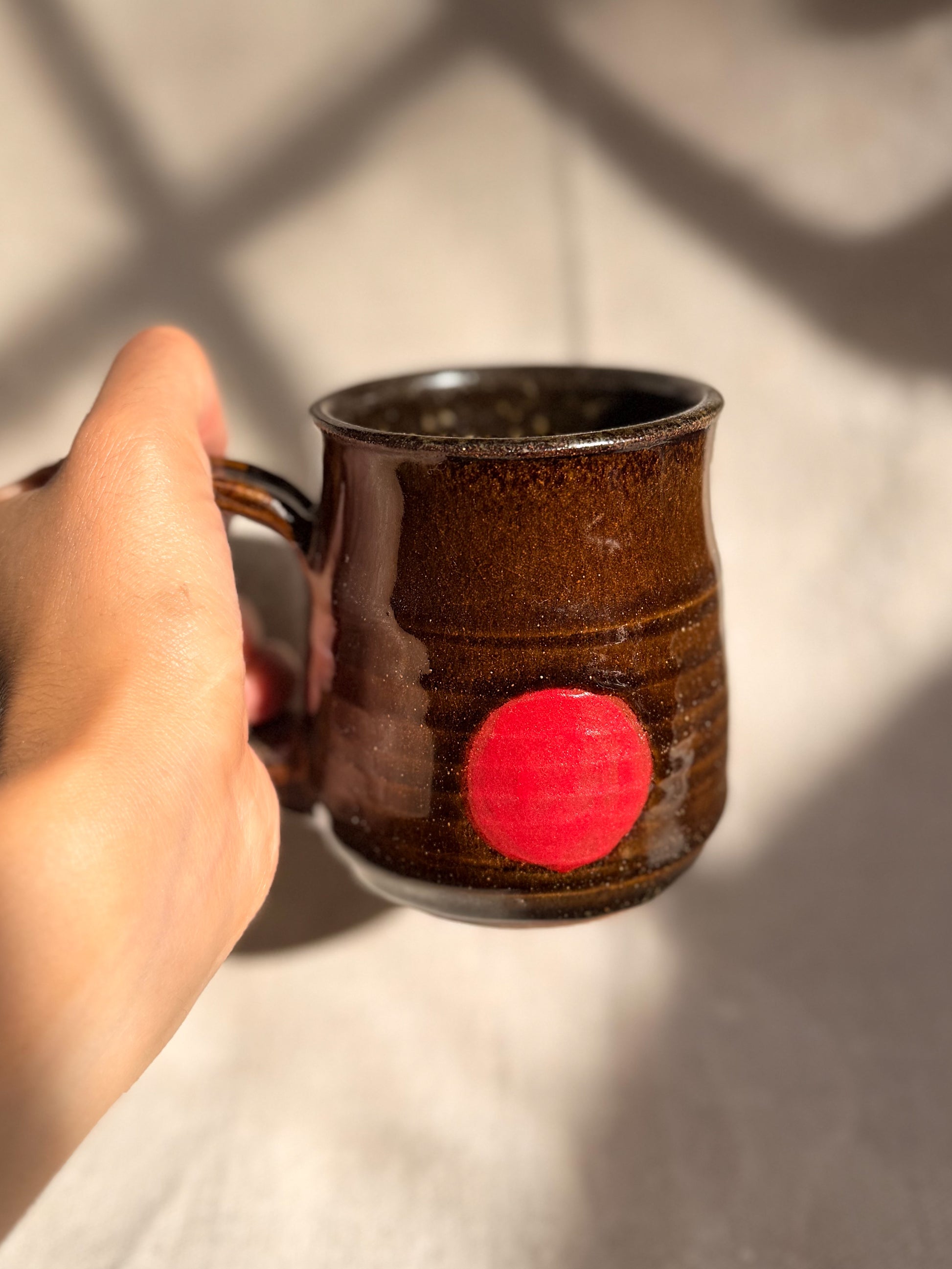 ceramic mug with red line with a canvas backgroud
